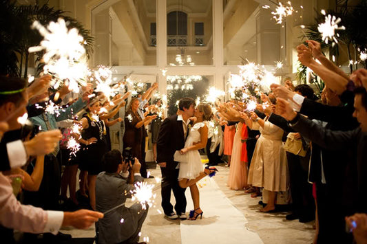 wedding sparklers lighting up bride and groom