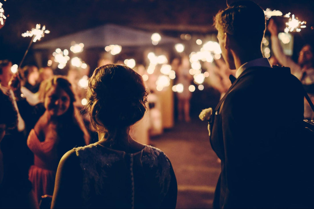 crowd at wedding using wedding sparklers