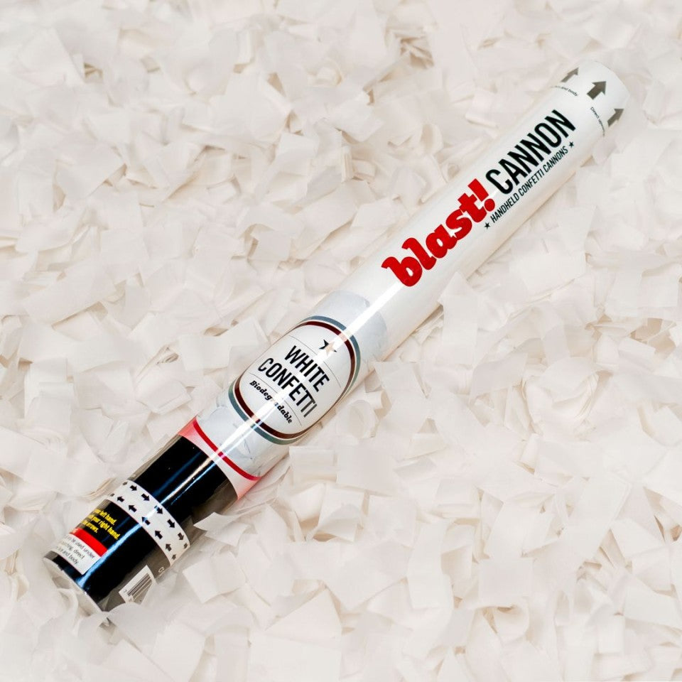 white confetti cannon with white confetti background