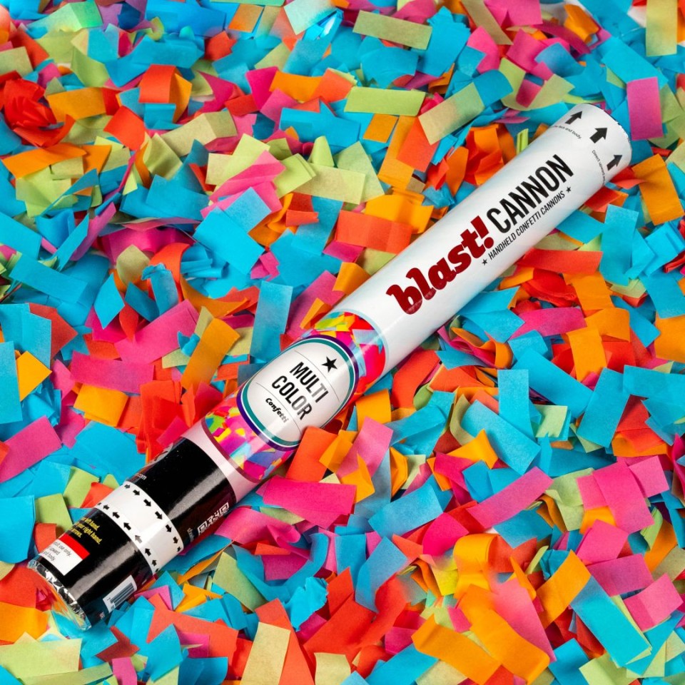 multi-color confetti cannon with multi-color ribbon background