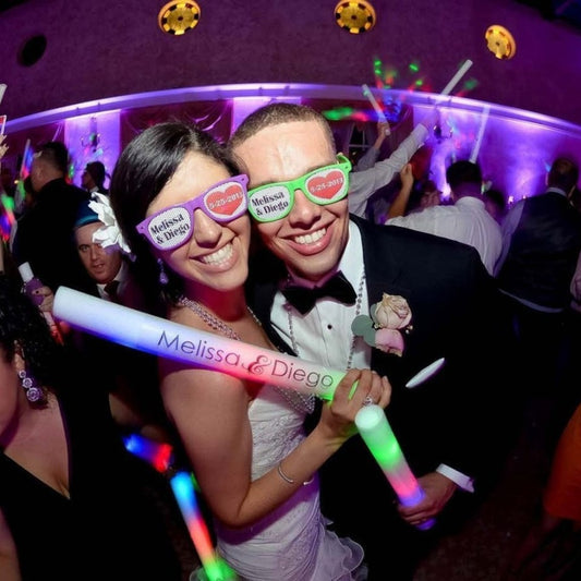 bride and groom holding LED foam batton